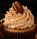 Brown butter eggnog bourbon cupcake with candied pecans